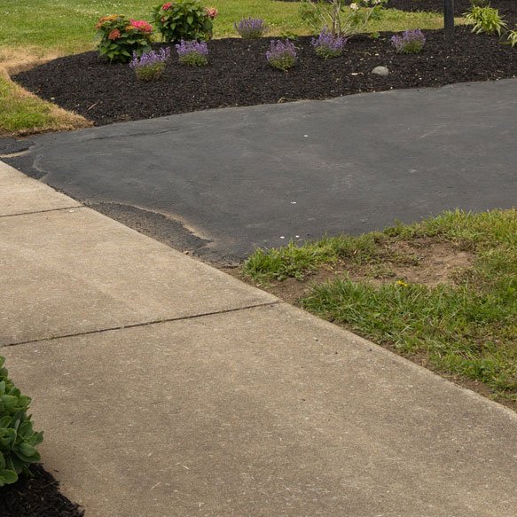 concrete walk and flower beds