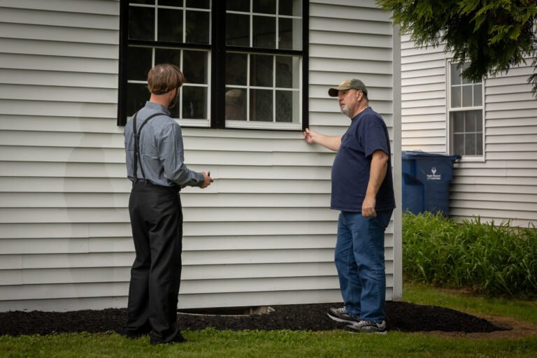 Mel inspects a house with a client